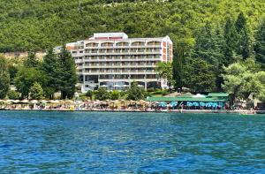 a hotel on the shore of a body of water at Hotel Bellevue - Metropol Lake Resort in Ohrid