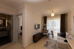 TV a/nebo společenská místnost v ubytování Kamer Exclusive Hotel & Suites