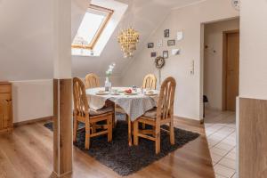 a dining room with a table and chairs at 50188Ferienwohnung Windspiel in Harlesiel