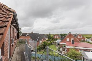 a view from the balcony of a house at 50188Ferienwohnung Windspiel in Harlesiel