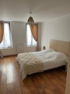 Ένα ή περισσότερα κρεβάτια σε δωμάτιο στο Havre de paix, centre ville de Châlons en Champagne