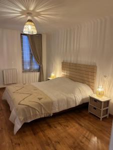 Ένα ή περισσότερα κρεβάτια σε δωμάτιο στο Havre de paix, centre ville de Châlons en Champagne