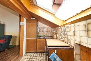 a large kitchen with a skylight in a room at Ferienwohnung Promenadenweg Nesselwang 14-8 in Nesselwang