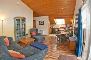 a living room with a couch and a table at Ferienwohnung Promenadenweg Nesselwang 14-8 in Nesselwang