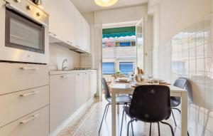 a kitchen with a table and chairs in a kitchen at 1 Bedroom Stunning Apartment In Recco in Recco