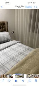 a picture of a bed in a bedroom at Charmant appartement in Casablanca