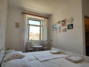 Postel nebo postele na pokoji v ubytování Guesthouse Franko