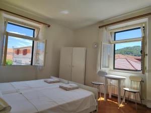 Postel nebo postele na pokoji v ubytování Guesthouse Franko