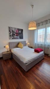 A bed or beds in a room at Style Homes Brera San Marco 29