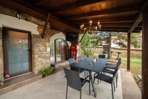 an outdoor patio with a table and chairs at Stella Guesthouse in Arbanasi