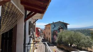 a view of a street from a balcony of a building at Casetta Sant'Angelo in SantʼAngelo
