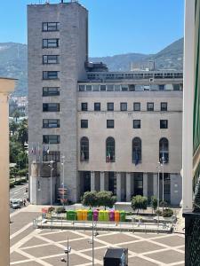 a large stone building with a parking lot in front of it at La Casa di Cloe in La Spezia