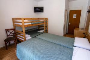 Letto o letti in una camera di Albergo Stazione