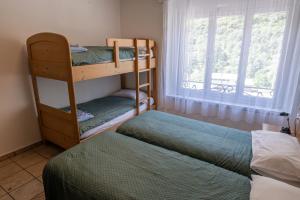Letto o letti in una camera di Albergo Stazione