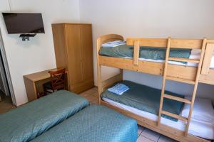 Letto o letti in una camera di Albergo Stazione