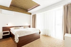 Postel nebo postele na pokoji v ubytování Hotel Šariš + 29 fotografií