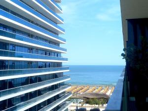 a view of the ocean from the balcony of a building at Black Sea Luxury Apartament - Mamaia Nord Beachfront in Mamaia Nord