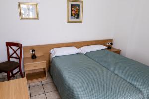 Letto o letti in una camera di Albergo Stazione