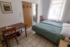 Letto o letti in una camera di Albergo Stazione
