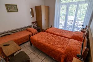 Letto o letti in una camera di Albergo Stazione