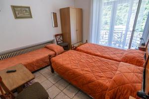 Letto o letti in una camera di Albergo Stazione