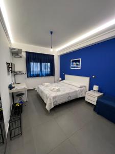 A bed or beds in a room at Sicilia Bedda B&B