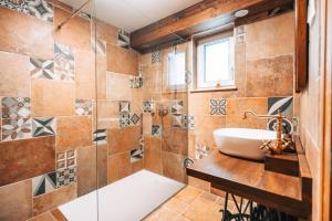 a bathroom with a sink and a shower at Posest Kunigunda in Šmartno v Rožni Dolini