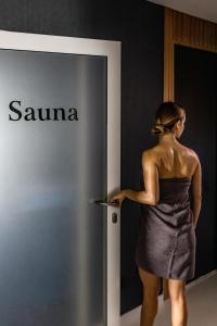 a woman standing in front of a samsung sign at Willa Port in Ostróda +106 photos
