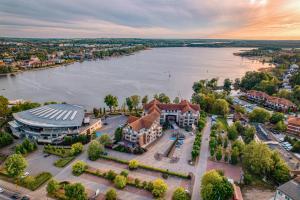 an aerial view of a building next to a river at Willa Port in Ostróda