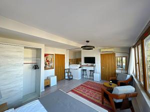 a room with a living room and a kitchen with a table at Million Old City Apartment in Istanbul