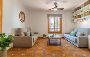 a living room with two couches and a coffee table at Stunning Home In Casarabonela in Casarabonela