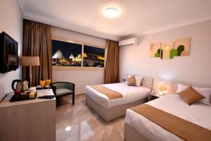 Letto o letti in una camera di Topview Pyramids And Museum