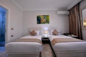Letto o letti in una camera di Topview Pyramids And Museum