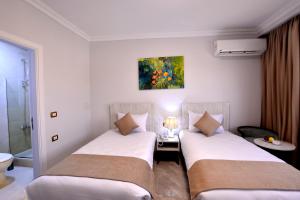Letto o letti in una camera di Topview Pyramids And Museum