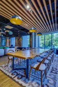 a large conference room with a long table and chairs at SADU hotel in Almaty