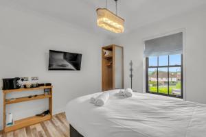 Vuode tai vuoteita majoituspaikassa Pass the Keys Larkey View a Tranquil Space for Two