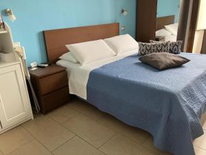 Postel nebo postele na pokoji v ubytování Jonio B&B