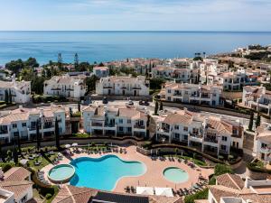 an aerial view of a resort with a swimming pool at NAU Salema Beach Village in Salema