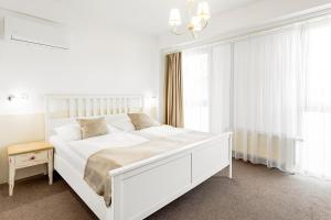 Postel nebo postele na pokoji v ubytování Hotel Šariš