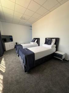 Postel nebo postele na pokoji v ubytování Hotel Daly