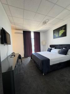 Postel nebo postele na pokoji v ubytování Hotel Daly