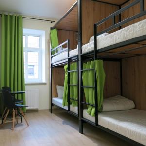 Postel nebo postele na pokoji v ubytování FOKA Hostel