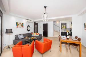 a living room with a couch and a table at Villa Ira in Lachania