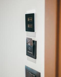 a control panel in a room with a door at Monun Hotel in Ksamil
