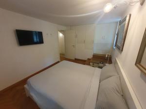 Ένα ή περισσότερα κρεβάτια σε δωμάτιο στο B&B Carazzole