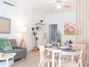 a living room with a table and a couch at ISG Apartments Triana Jacuzzi 1 in Seville