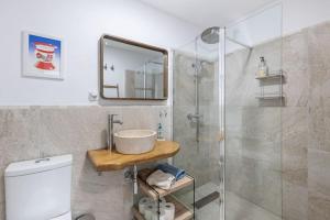 a bathroom with a sink and a shower at Casa Luna - Townhouse in Granada with open Terrace in Granada +30 photos