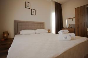 Postel nebo postele na pokoji v ubytování First Class by Antalya Suites + 25 fotografií