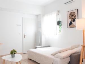 Cama o camas de una habitación en Estudio Jacuzzi con Encanto en Triana