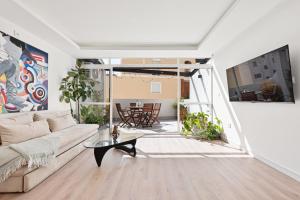 a living room with a couch and a table at Spiteri 12 by Pineapple Homes in Málaga